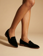 Women's Penny Loafers - Round Toe - Low Block Heel - Black, side view on model