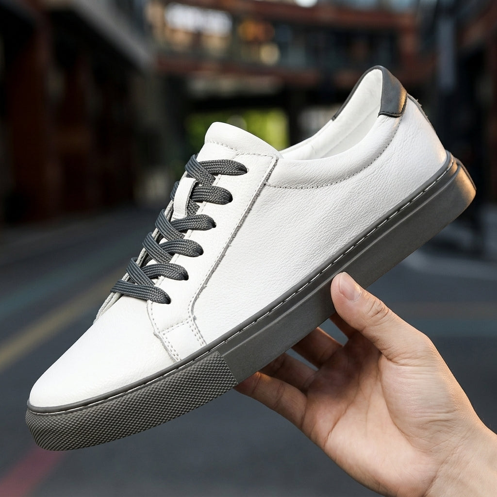 Men's Leather-Look Low-Top Trainers - Lace-Up Plain Toe - Gray & White, held in hand