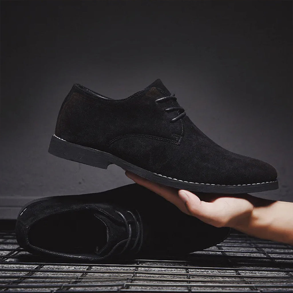 Men's Classic Lace-Up Derby Shoes - Plain Toe - Black pair, held in hand